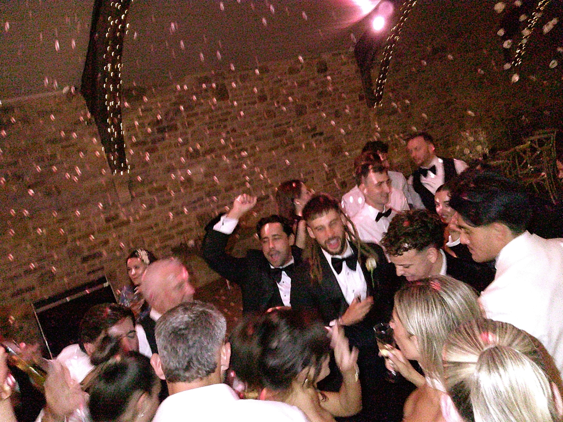 Groom and groomsmen singing on the dancefloor, shot on SnapBox