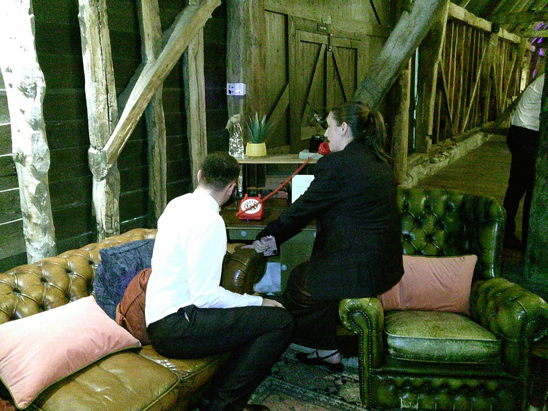 Guests using the red RingBox handset at a wedding