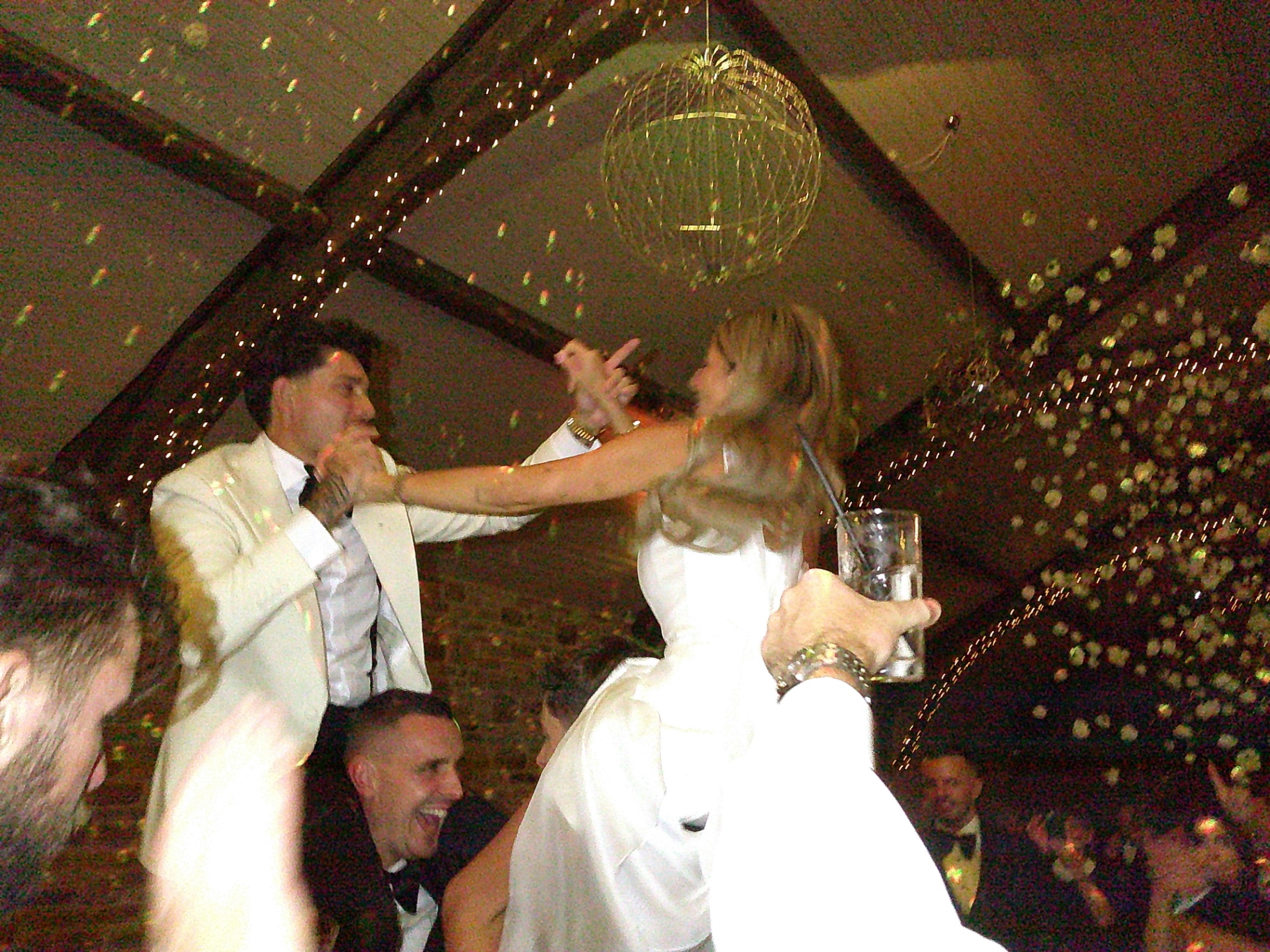 Bride and groom lifted up on the dancefloor, shot on SnapBox