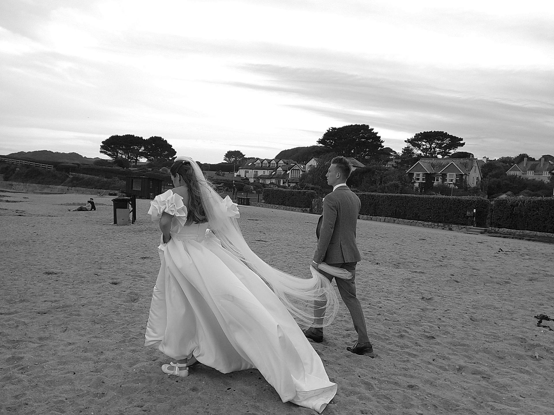 Bride and groom walking along the beach, shot on SnapBox