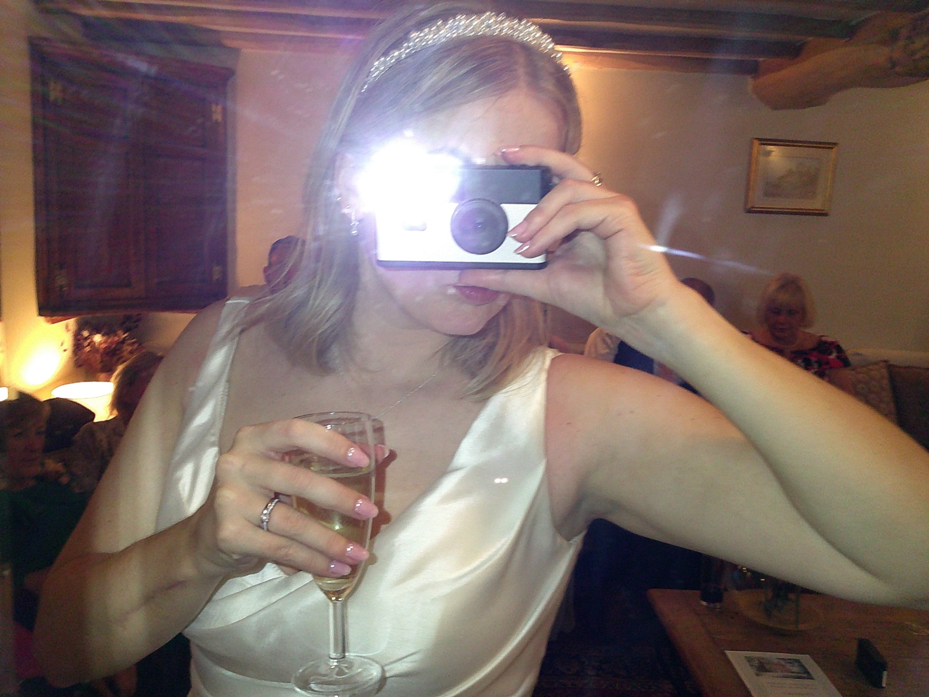 Bride taking a selfie with a SnapBox camera